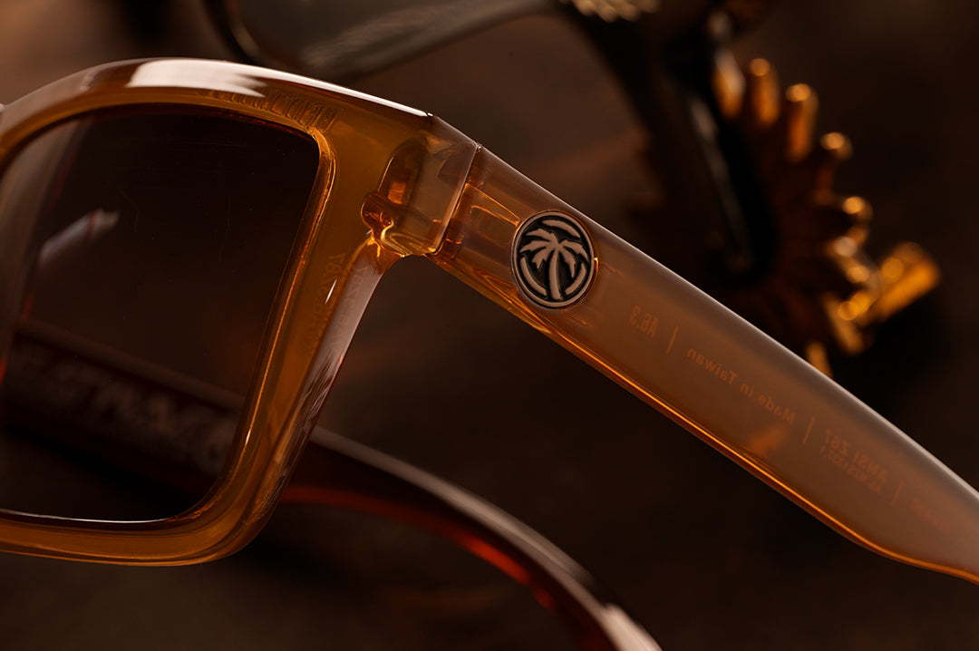 Close up shot of the XL VISE Sunglasses: Saddle Z87 on a wood table. 