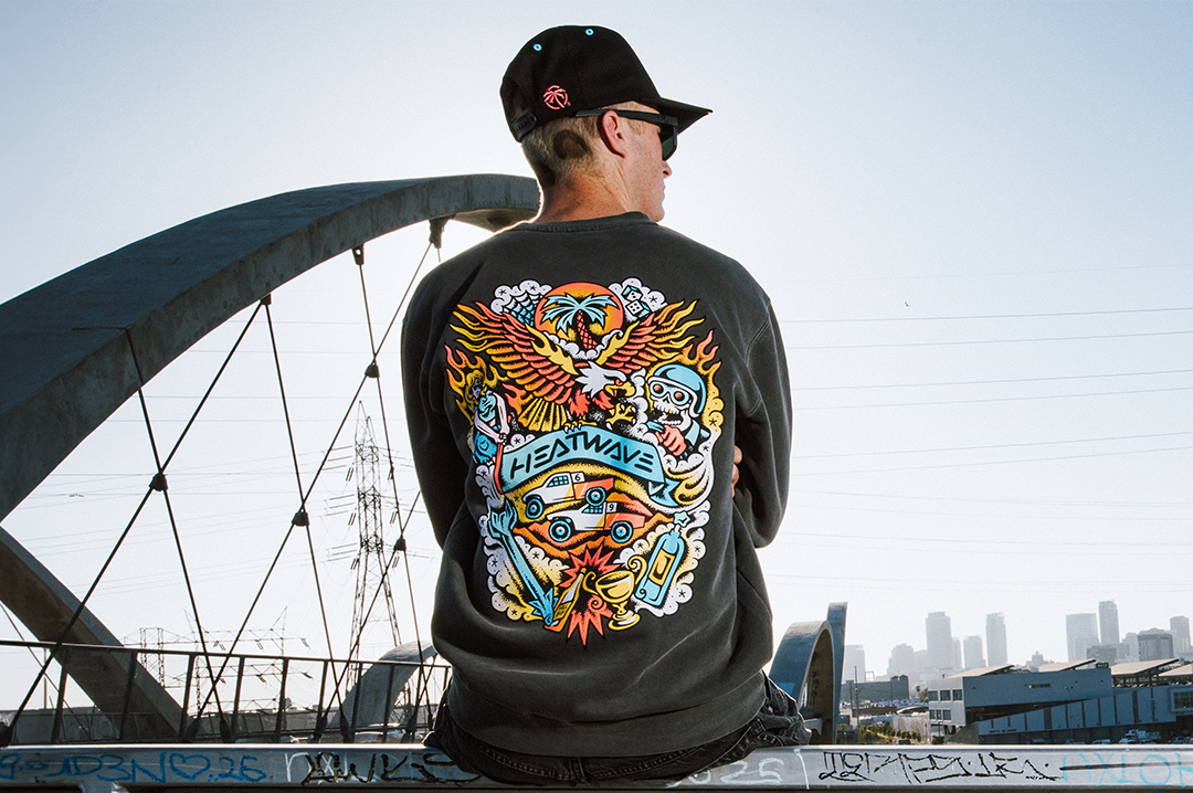 Man wearing the Heat Wave x Tallboy Flash Crewneck Sweatshirt - Black showing the backside
