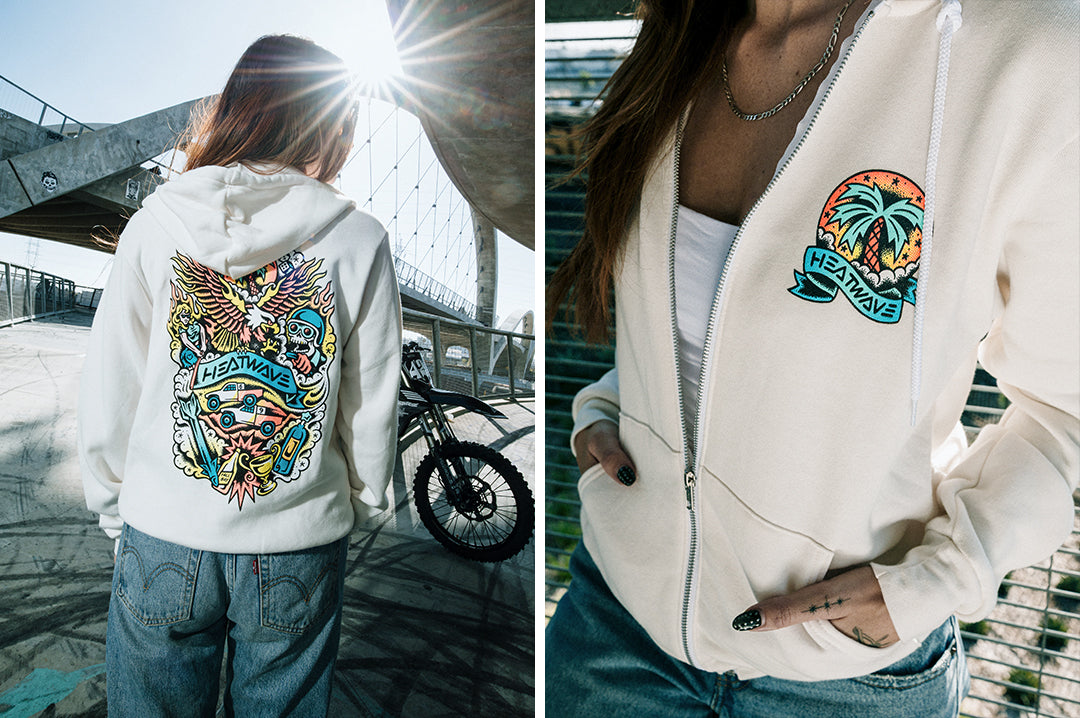 Woman wearing the Heat Wave x Tall Boy Flash Ladies Oversized Zip Sweatshirt - White showing the front and back side