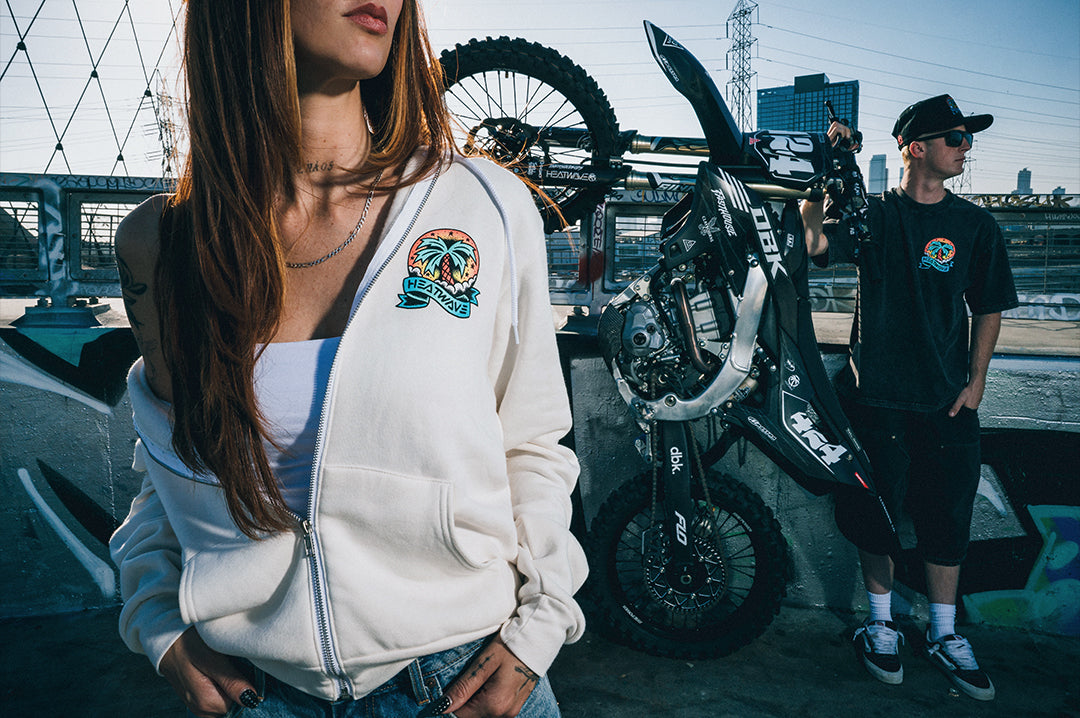 Woman wearing the Heat Wave x Tall Boy Flash Ladies Oversized Zip Sweatshirt - White