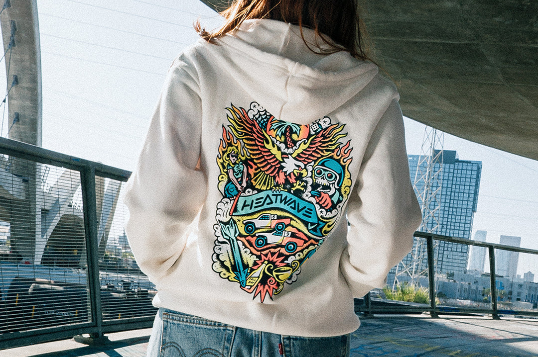 Woman wearing the Heat Wave x Tallboy Flash Ladies Oversized Zip Sweatshirt - White showing the backside