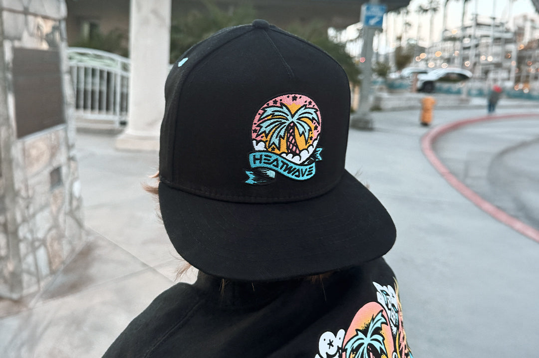 Boy wearing the Heat Wave x Tall Boy Youth Icon Flash Hat - Black
