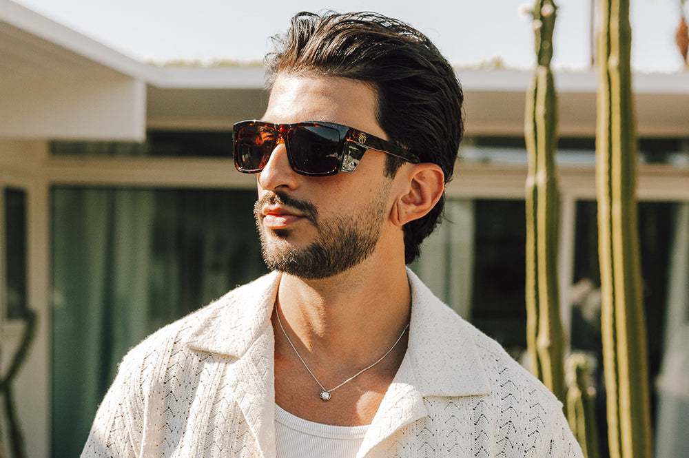 Man outside rocking the Heat Wave Visual Performance XL Vise Sunglasses with tortoise frame, brown lenses and matching sides shields.