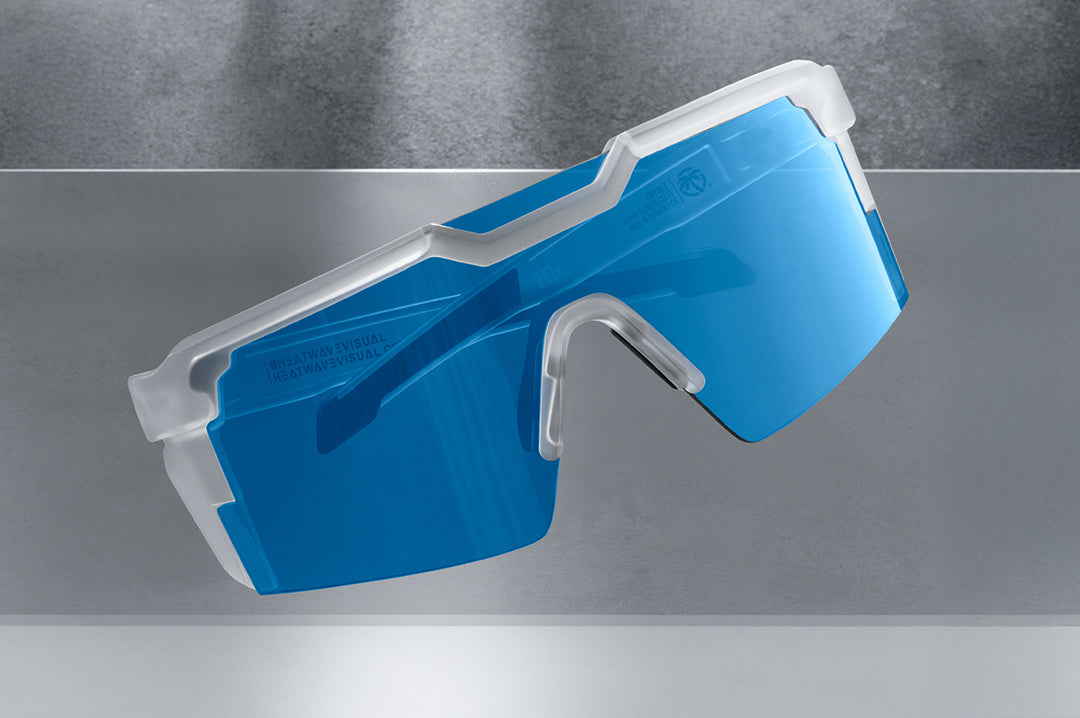 Indoor studio shot of the Future Tech Sunglasses: Vapor Frost Frame Coastal Lens Z87+ on a concrete block.