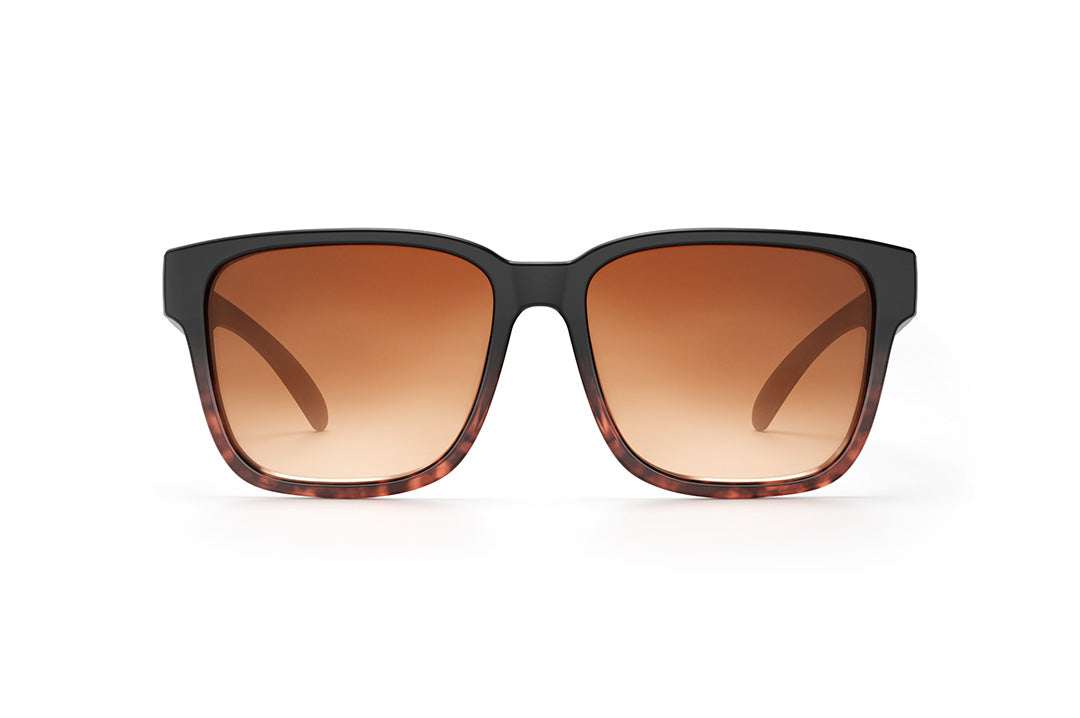 Front of Heat Wave Visual Apollo Sunglasses with black and tortoise brown frame and brown gradient lenses.
