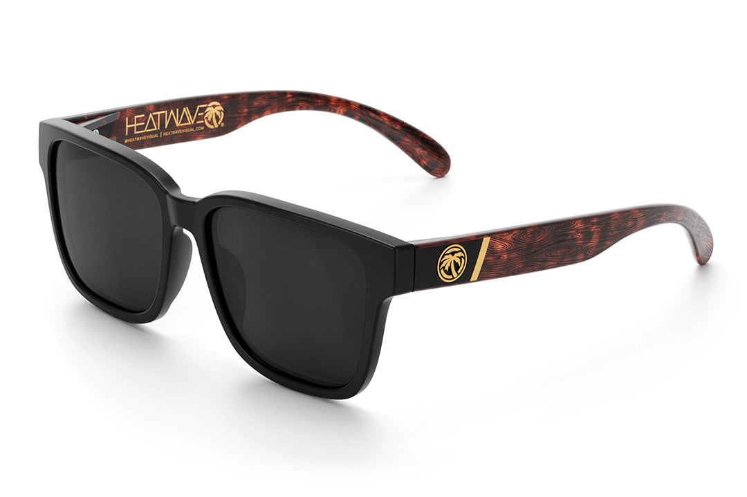 Heat Wave Visual Apollo Sunglasses with black frame, brown woodgrain print arms and black lens.