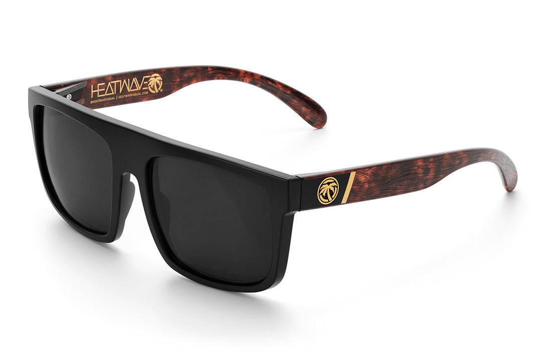 Heat Wave Visual Regulator Sunglasses with black frame, woodgrain print arms and black lenses.