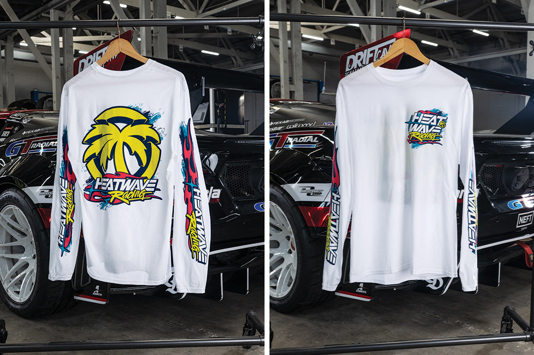 Front and back of the Heat Wave Y2K Racing White Long Sleeve T-Shirt hanging in front of a car