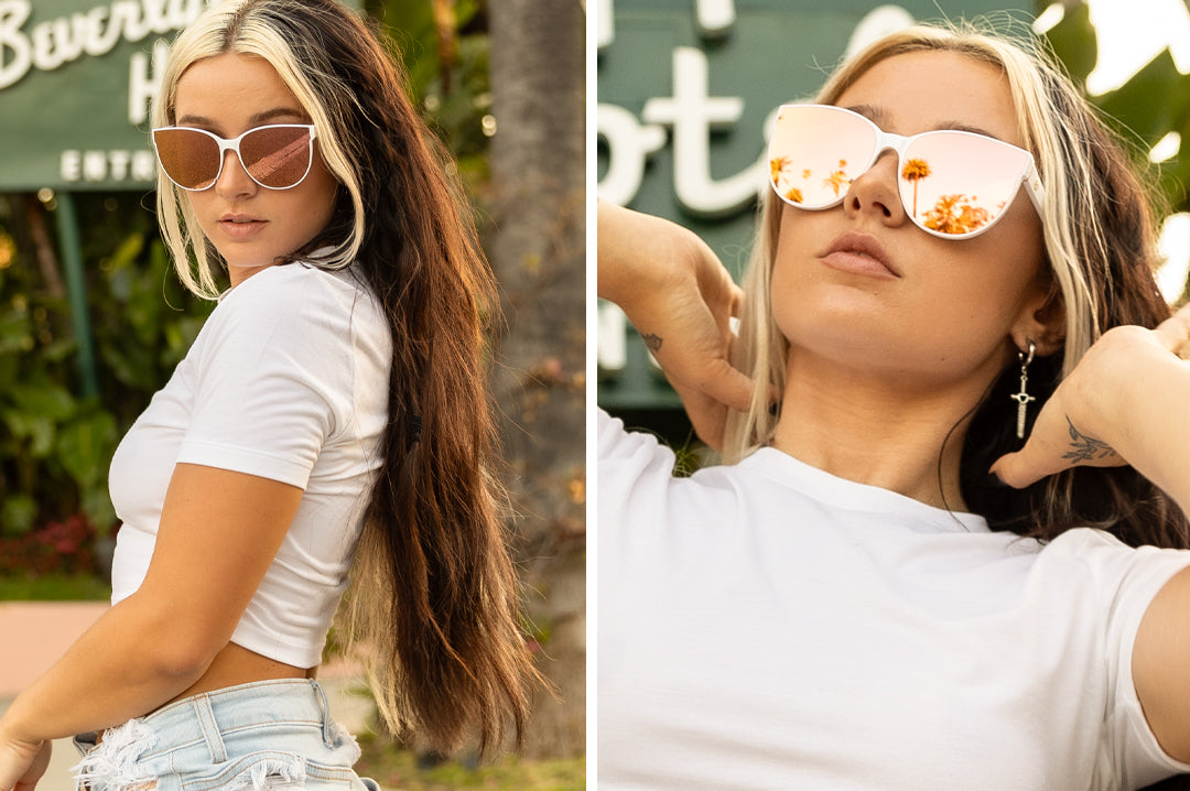 Women out in Beverly Hills wearing the Heat Wave Visual Womens Carat Sunglasses with white frame and rose gold lenses.