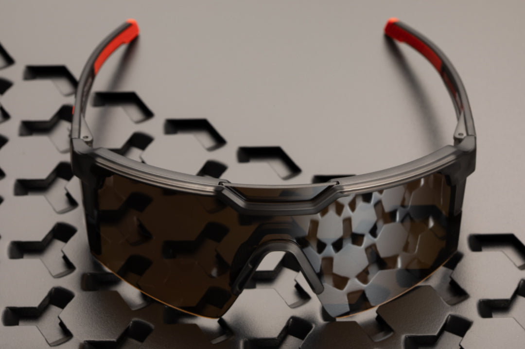 Top of the Heat Wave Visual Future Tech Sunglasses with frosted smoke frame, ring print arms and silver lens.