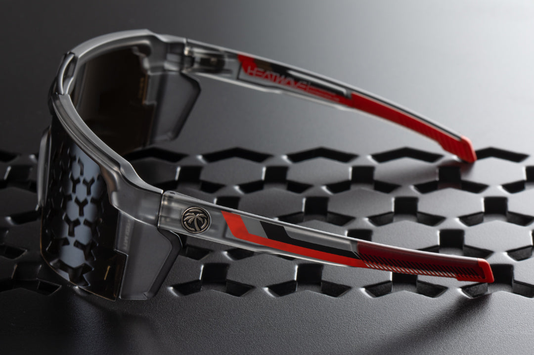 Side of the Heat Wave Visual Future Tech Sunglasses with frosted smoke frame, ring print arms and silver lens.