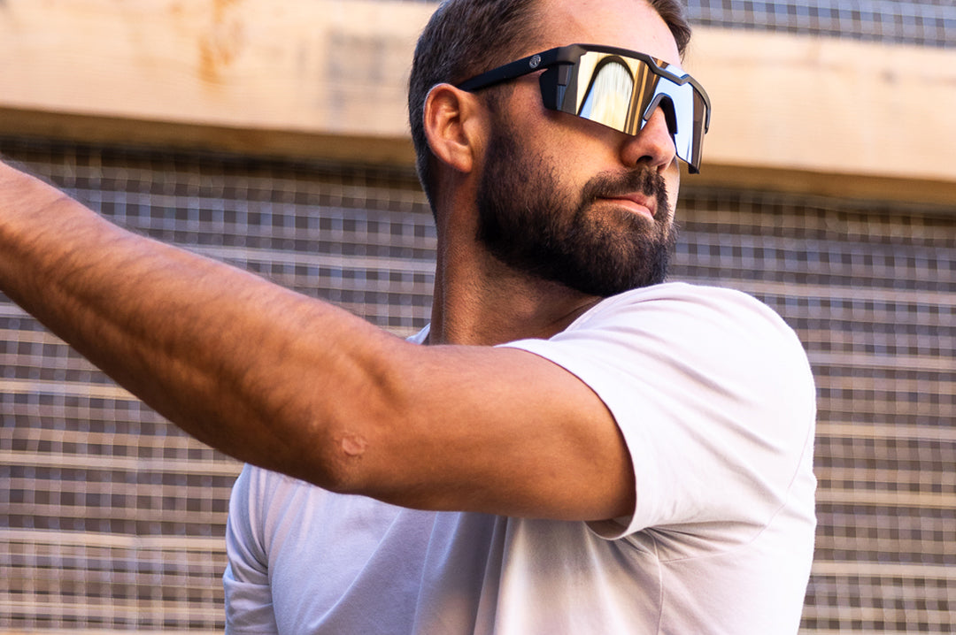 Gentleman wearing the Heat Wave Visual Future Tech Sunglasses wth black frame and silver lens.
