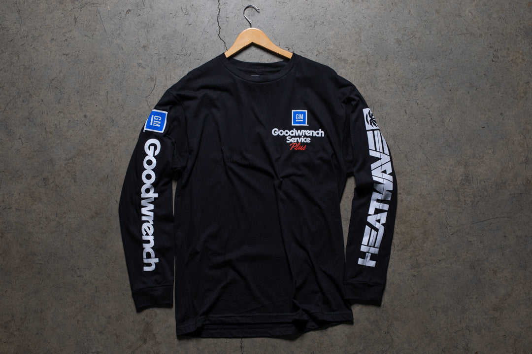 Laying on the ground is the Heat Wave Visual GM Goodwrench black long sleeve with nascar graphic on the back.