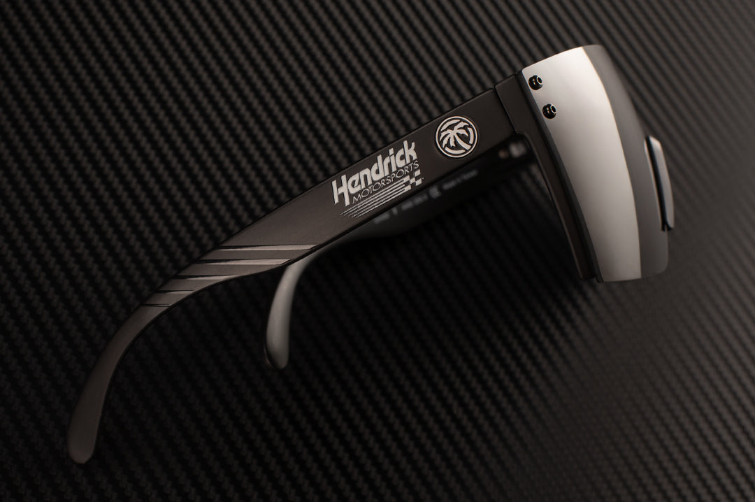 Lying on it's side is the Hendrick Motorsports x Heat Wave Visual Lazer Sunglasses.