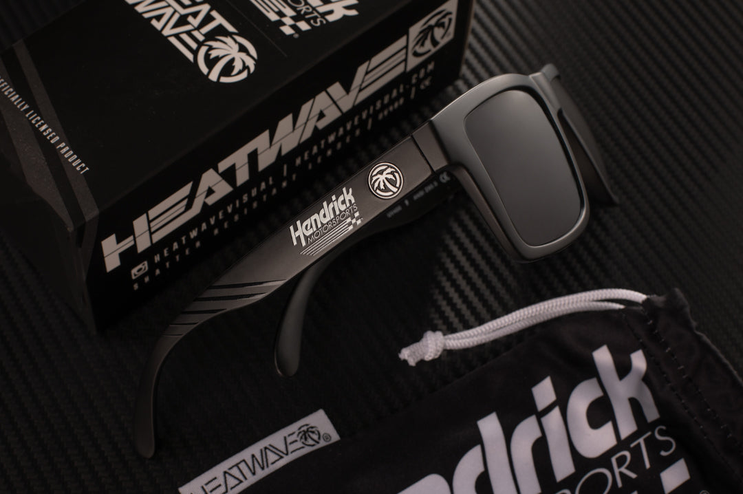 Hendrick Motorsports x Heat Wave Visual XL Vise Sunglasses lying on a table.