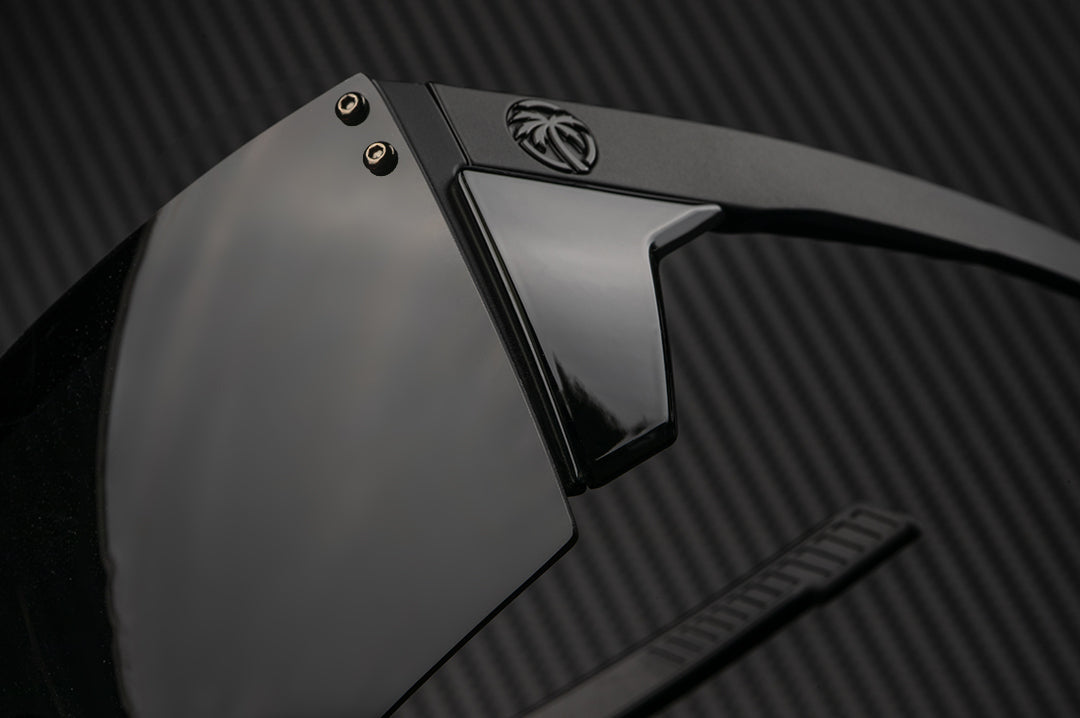 Side view of the Heat Wave Visual Performance XL Lazer Face Sunglasses with black frame, black lens and black side shields.