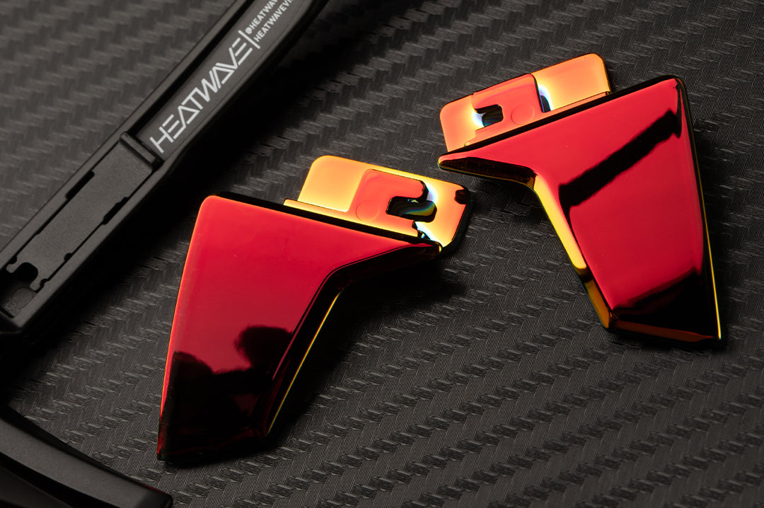 Laying on a table is the Heat Wave Visual Performance Lazer side shields.