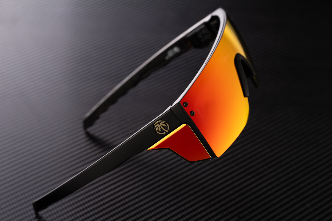 Heat Wave Visual Performance Lazer SLIM Sunglasses with black frame, firestorm red lens and side shields.