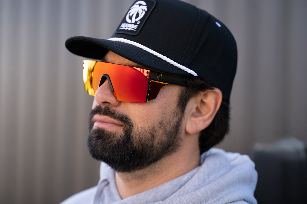 Bearded man wearing the Heat Wave Visual Performance Lazer SLIM Sunglasses with firestorm red lens.