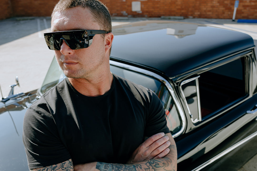 Ultra Black Heat Wave Lazer SLIM Sunglasses worn by tattooed Man