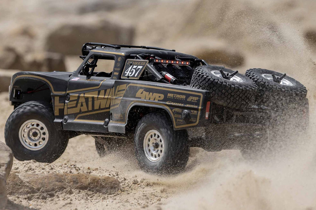 Action shot of the Heat Wave Visual X Losi Baja Rey 2.0 Chris Isenhouer remoted controlled truck. 