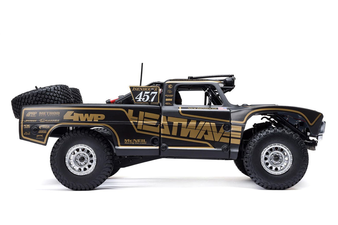 Side view of the Heat Wave Visual X Losi Baja Rey 2.0 Chris Isenhouer remoted controlled truck. 