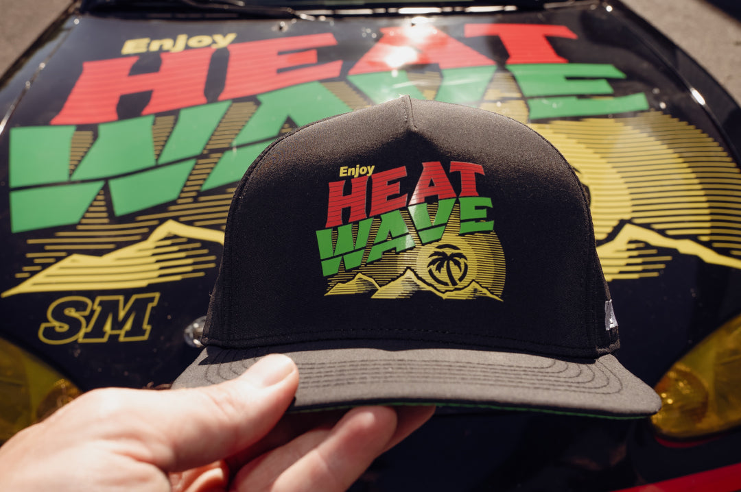 Hand hold the Heat Wave Visual Mello Wave Hat. 