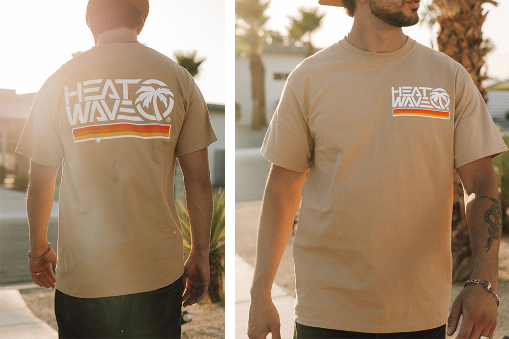 Young dude out walking in the Heat Wave Visual Retro Stripe Tan T-shirt.