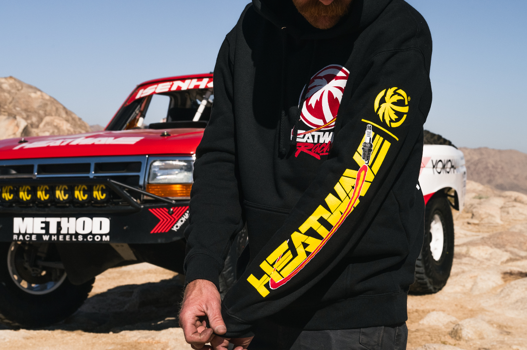 Close up of an Eisenhouer brother wearing the new spark racing Heat Wave hoodie with yellow graphics on the left arm.