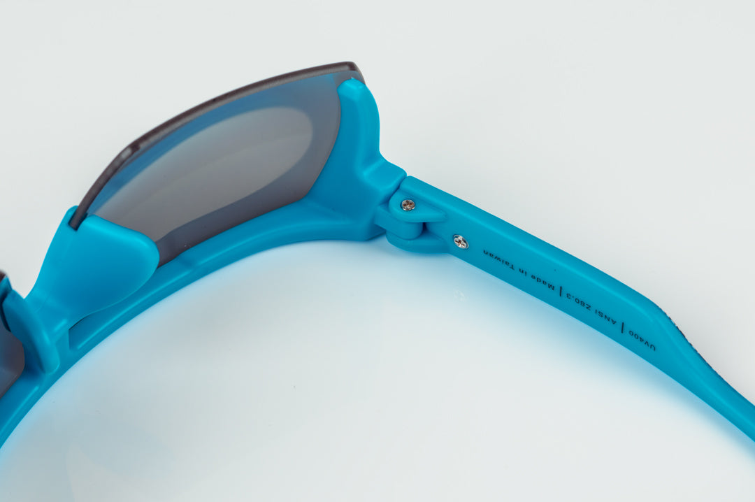 Inside of Heat Wave Visual Lazer Face kids sunglasses blue frame, static print arms and black lens.