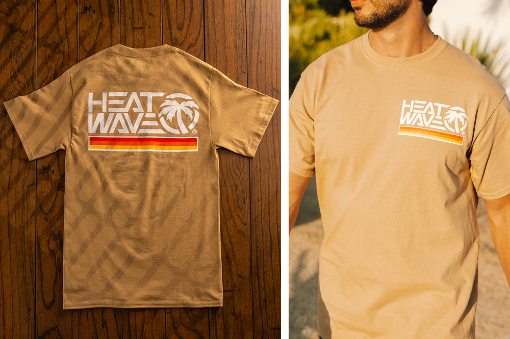 Lying on a wooden floor is the Heat Wave Visual Retro Stripe Tan T-shirt.
