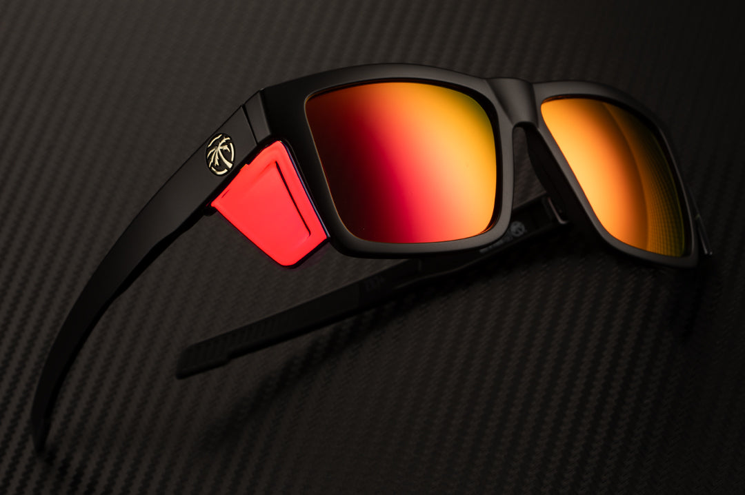 Side view of the Heat Wave Visual Performance Vise Sunglasses with black frame, firestorm red lenses and matching colored side shields.