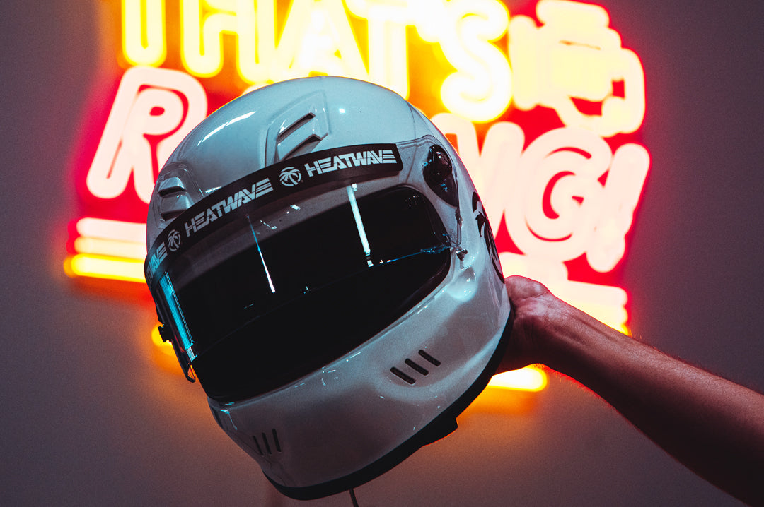 Heat Wave Visual Helmet Visor Sticker on a white racing helmet. 