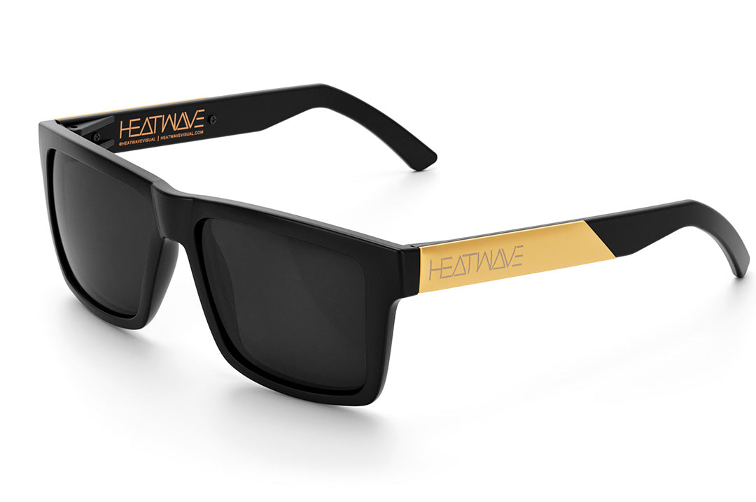 Heat Wave Visual Vise Sunglasses with black frame, gold metal arms and black lenses.