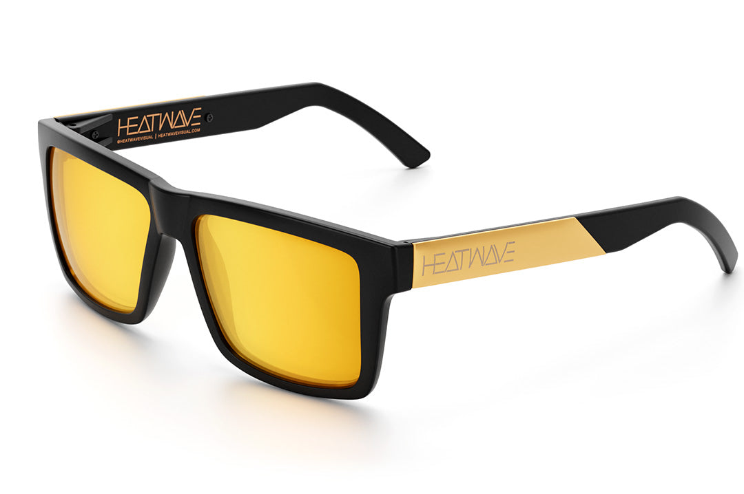 Heat Wave Visual Vise Sunglasses with black frame, gold metal arms and gold lenses.