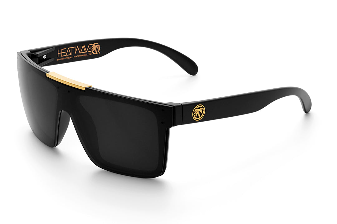 Heat Wave Visual Quatro Sunglasses with black frame, gold bar and black lens.