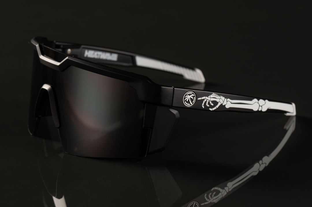 Side of Heat Wave Visual Future Tech Sunglasses with black frame with bone print arms and black lens.