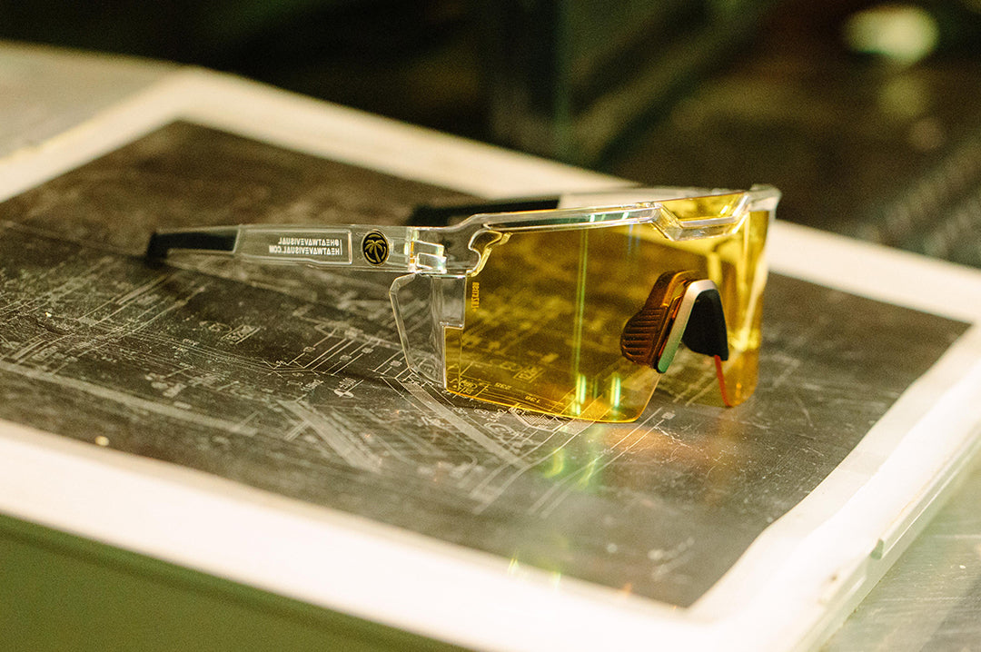 Side of Heat Wave Visual Future Tech Sunglasses with clear frame and hi vis yellow lens.