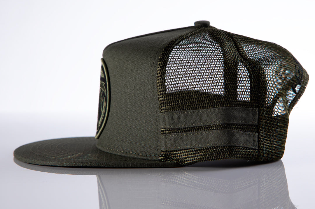 Side of Heat Wave Visual od green trucker hat with socom patch.