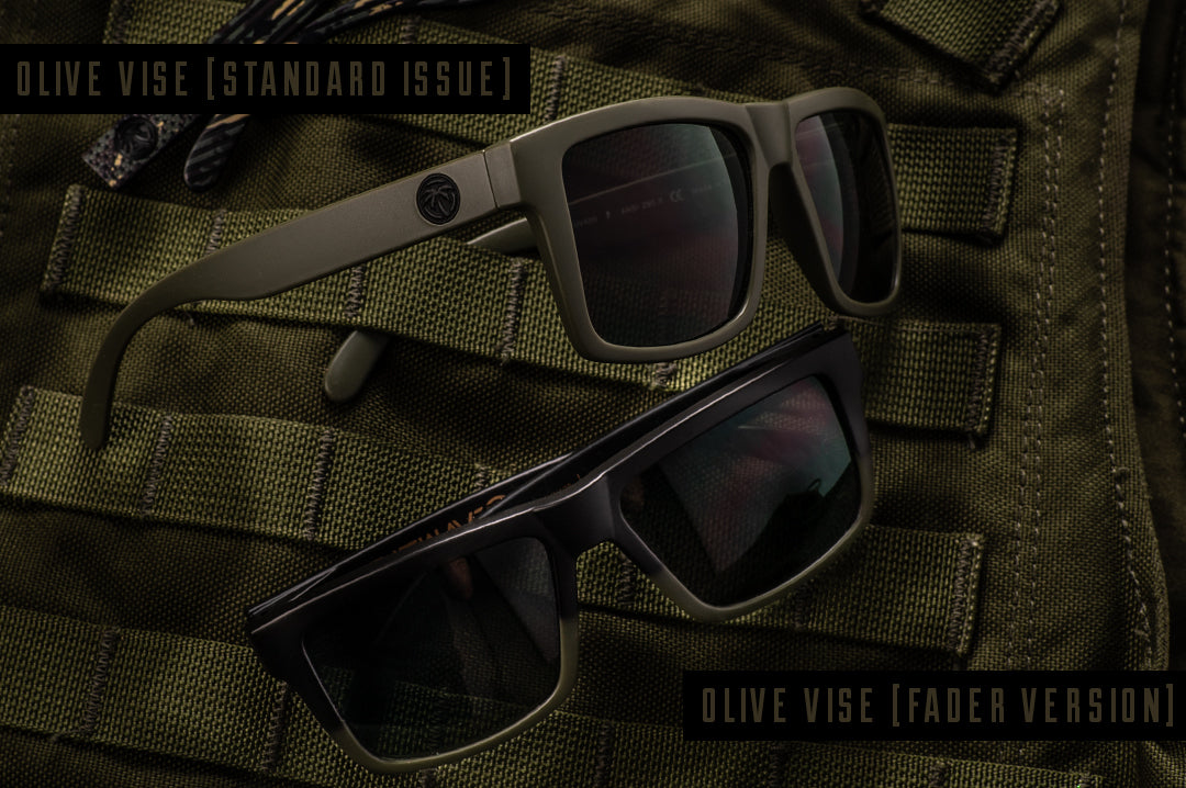 Two Heat Wave Visual Vise sunglasses on military vest. 