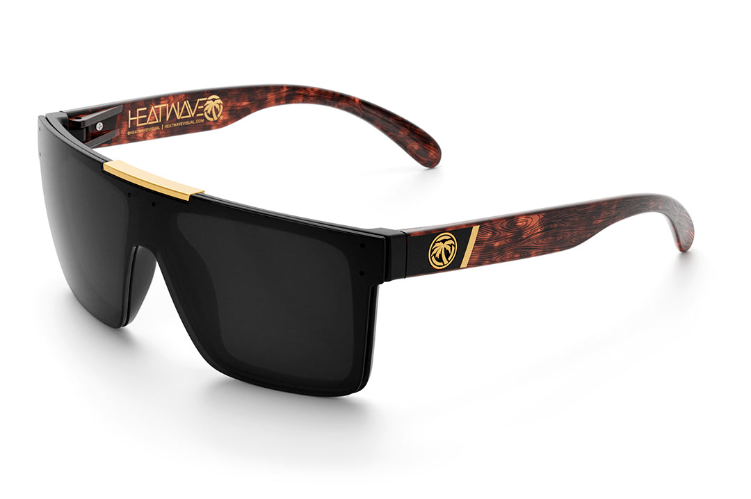 Heat Wave Visual Quatro Sunglasses with black frame, woodgrain print arms and black lens.
