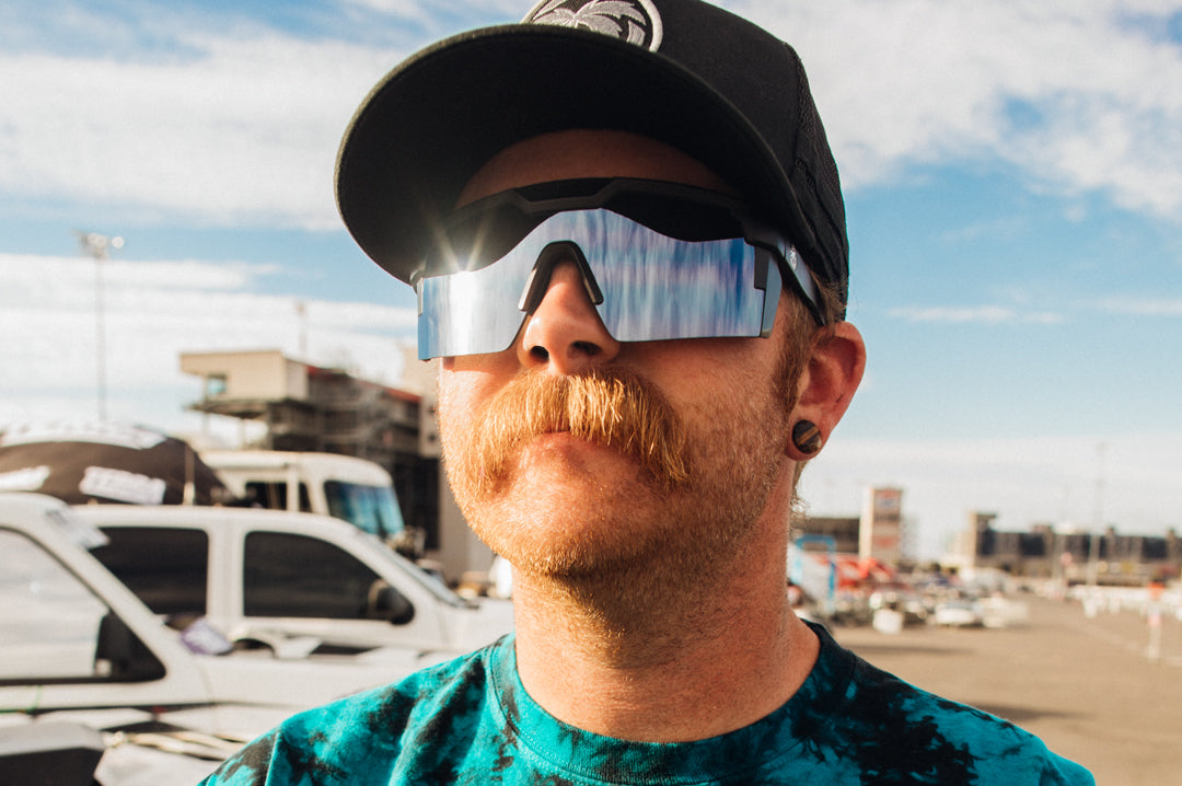 Truck racer Nick Isenhouer wearing Heat Wave Visual Future Tech Sunglasses with black frame and silver lens.
