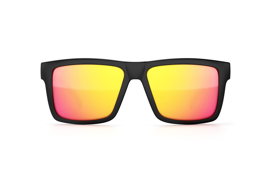 Front view of Heat Wave Visual Vise Sunglasses with black frame, pink blue white print arms and tropic pink yellow len