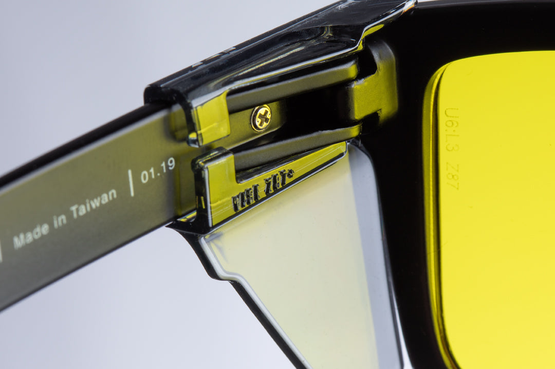 Heat Wave Visual Vise Smoke Side Shields placed on vise sunglasses.