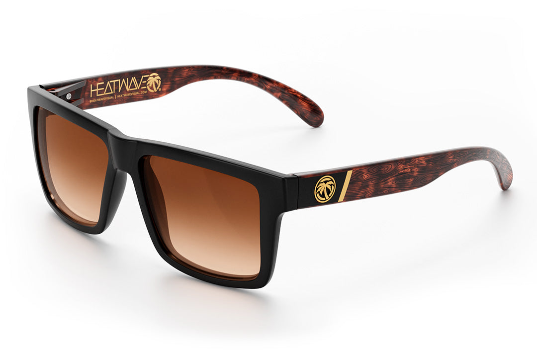Heat Wave Visual Vise Sunglasses with black frame, woodgrain print arms and brown gradient lenses.