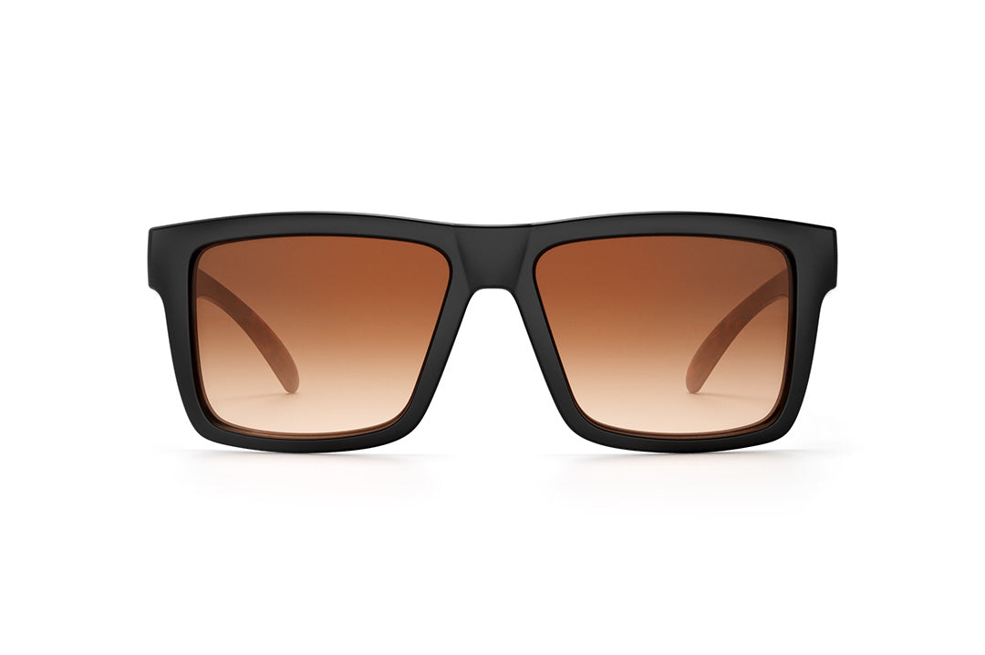 Front view of Heat Wave Visual Vise Sunglasses with black frame, woodgrain print arms and brown gradient lenses.
