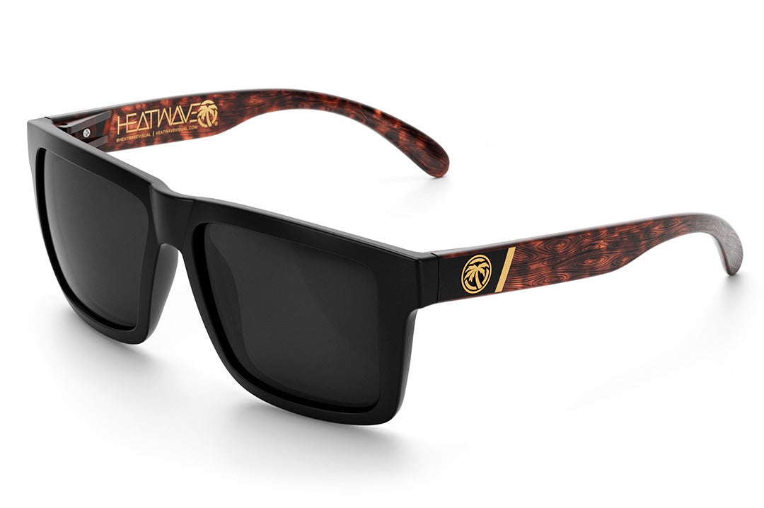 Heat Wave Visual XL Vise Sunglasses with black frame, woodgrain print arms and black lenses.