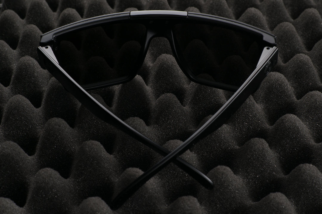 Back view of Heat Wave Visual Quatro Sunglasses with black frame, black bar and black lens.