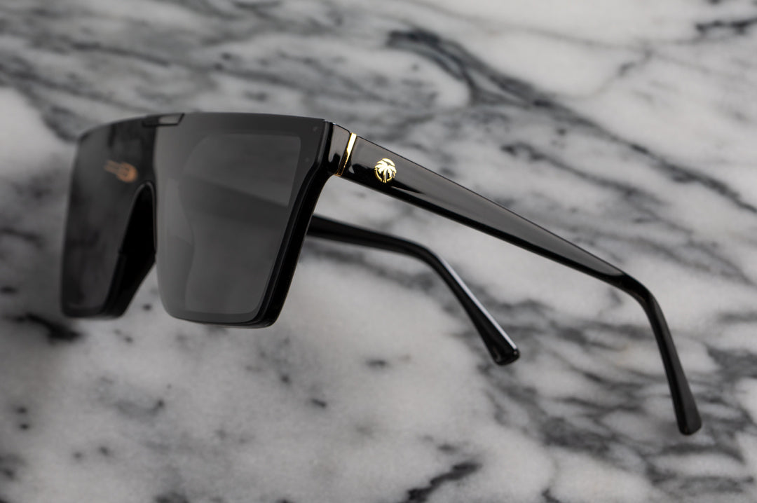 Side view of Heat Wave Visual Womens Clarity Sunglasses with black frame and black lens.