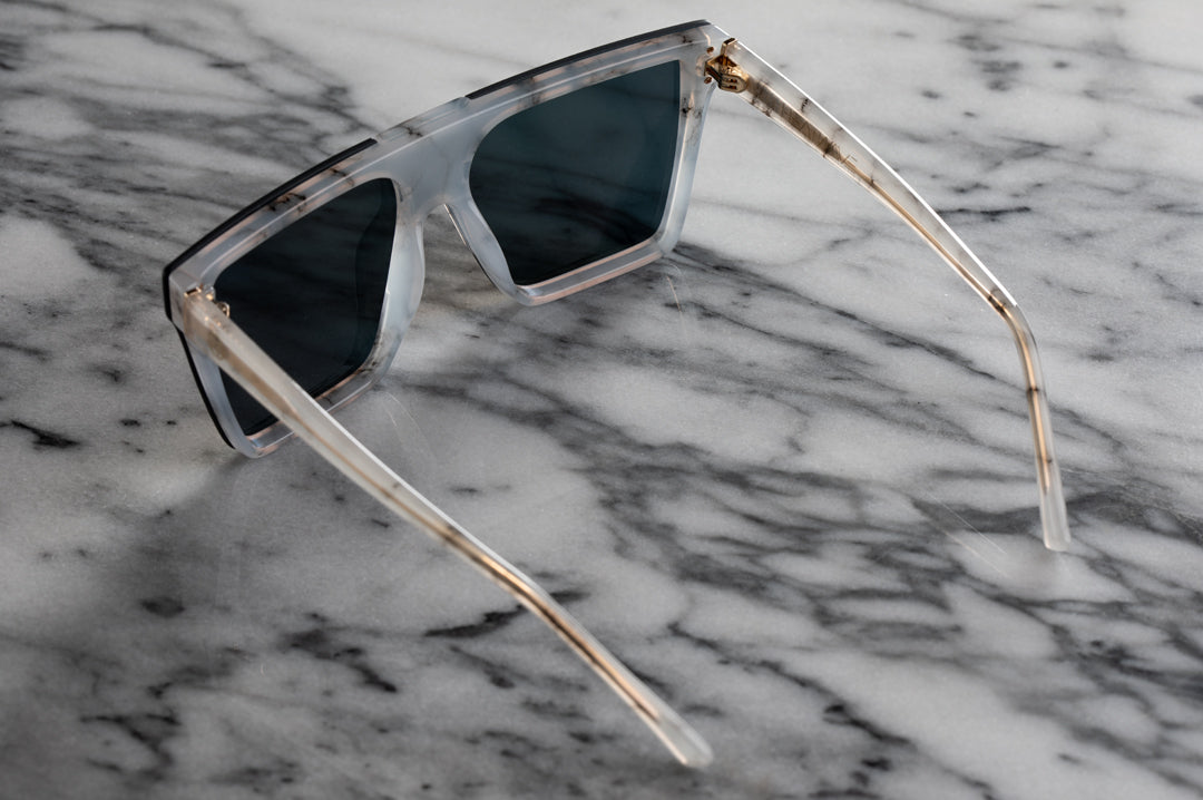 back of Heat Wave Visual Womens Clarity Sunglasses with marble frame.